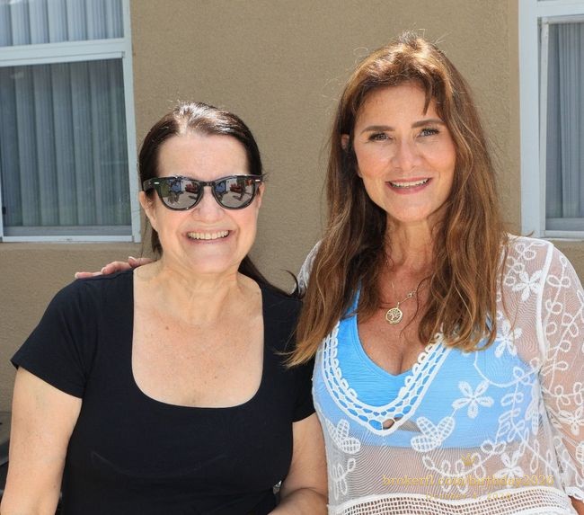 Karina Leal and Patricia “Patty” Lari smiling together at Karina’s birthday celebration in Delray Beach.