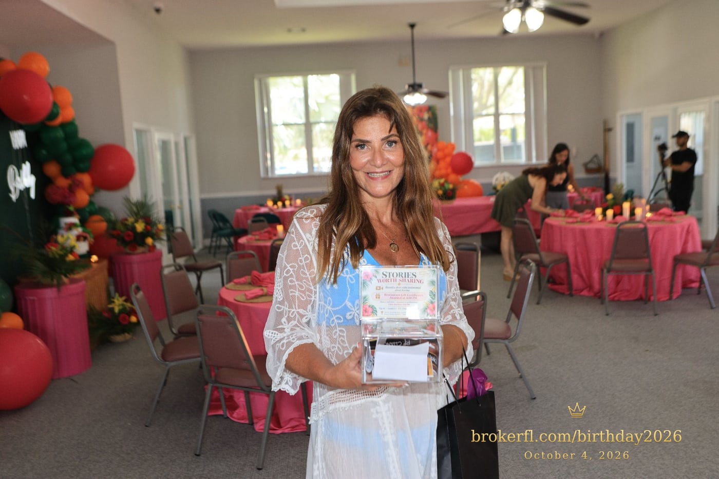 Guest in a white lace cover-up inside the decorated party room — Karina Leal's birthday, October 4, 2026.