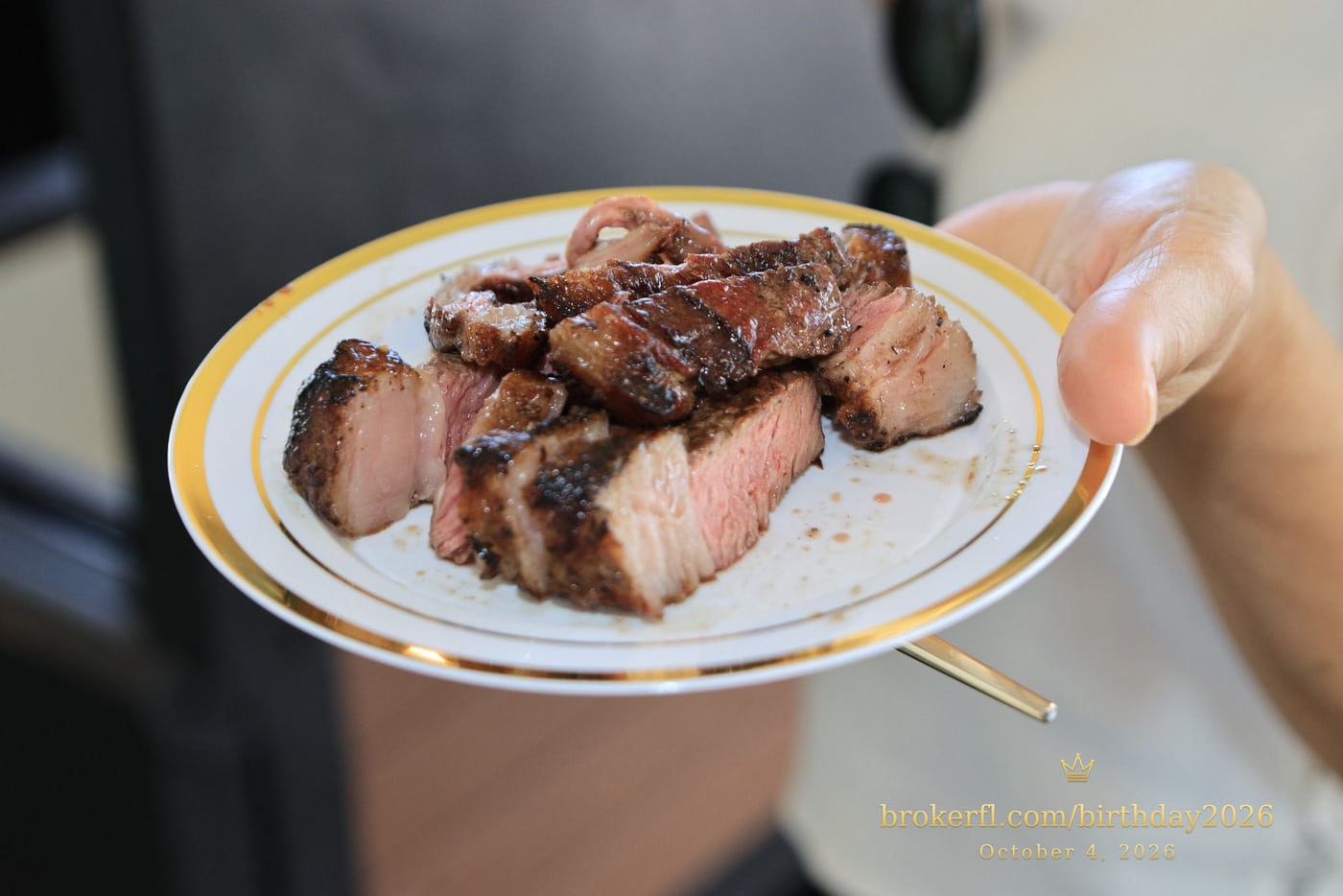 Plate of freshly sliced barbecue meat — Karina Leal's birthday, October 4, 2026.