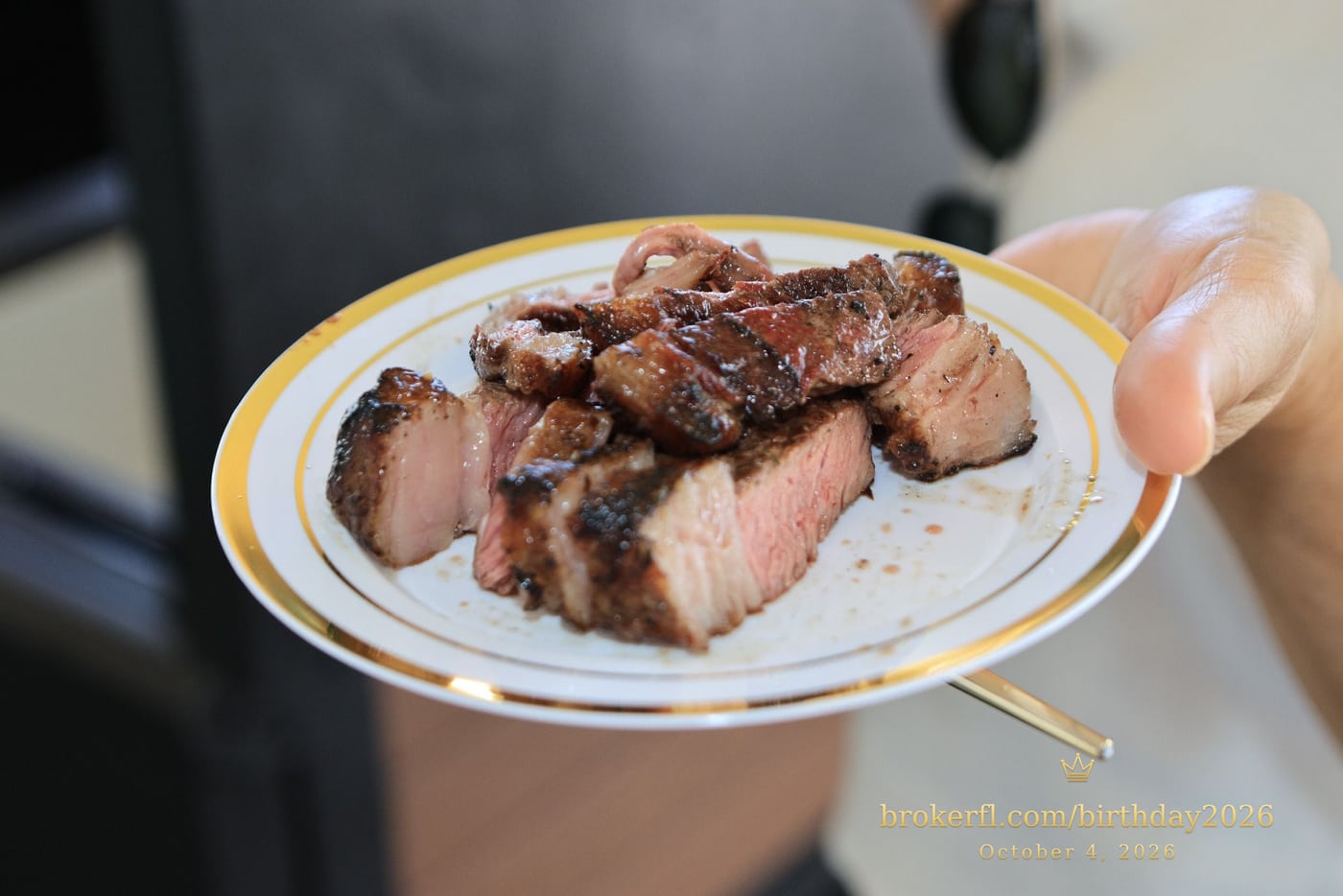 Plate of freshly sliced barbecue meat — Karina Leal's birthday, October 4, 2026.