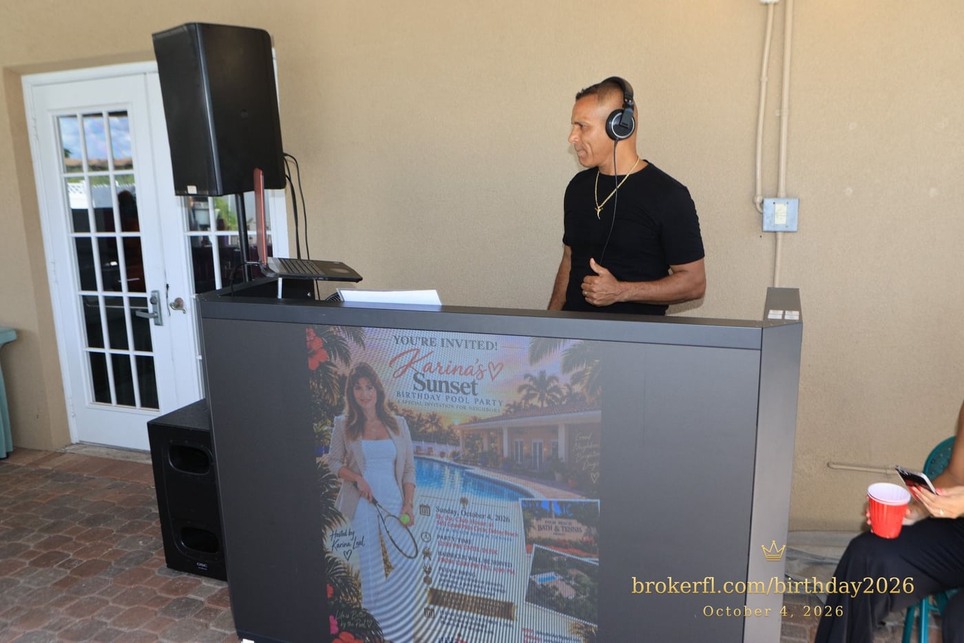 DJ behind the music booth inside the party room — Karina Leal's birthday, October 4, 2026.