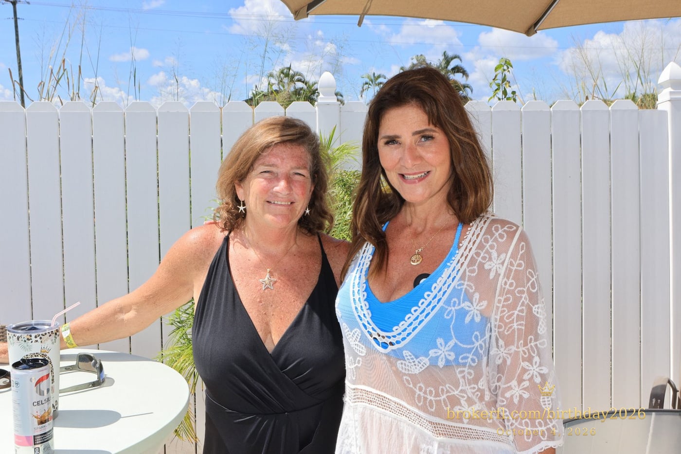Two guests posing beside the swimming pool — Karina Leal's birthday, October 4, 2026.