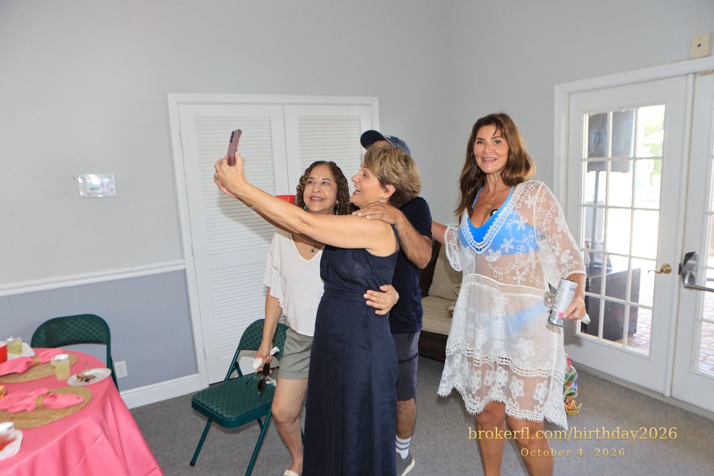 Friends taking a selfie inside the party room — Karina Leal's birthday, October 4, 2026.