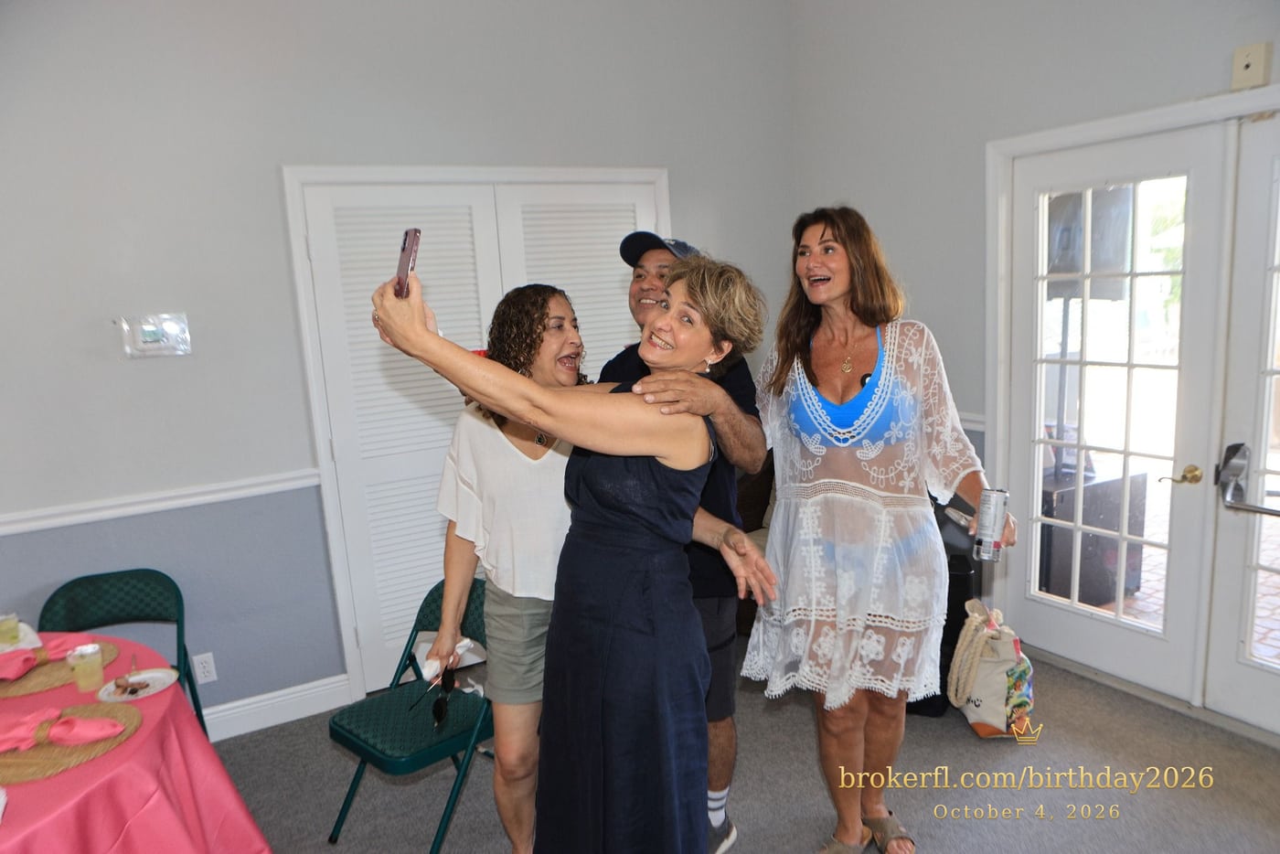 Friends taking a selfie inside the party room — Karina Leal's birthday, October 4, 2026.