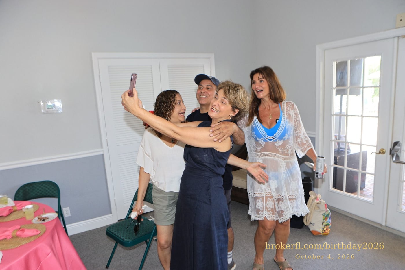 Friends taking a selfie inside the party room — Karina Leal's birthday, October 4, 2026.