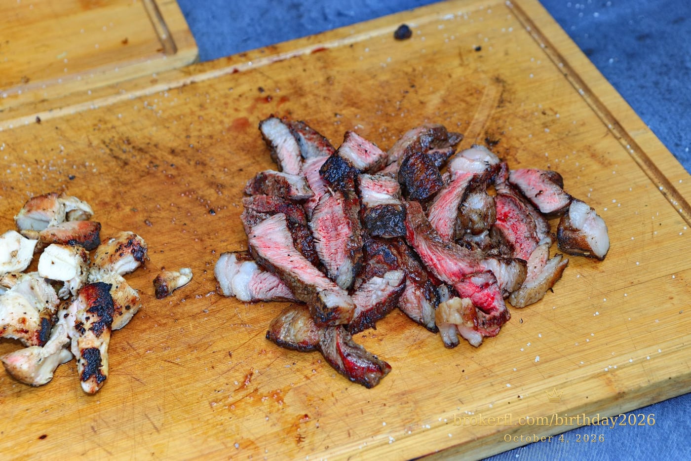 Sliced barbecue meat on a wooden serving board — Karina Leal's birthday, October 4, 2026.