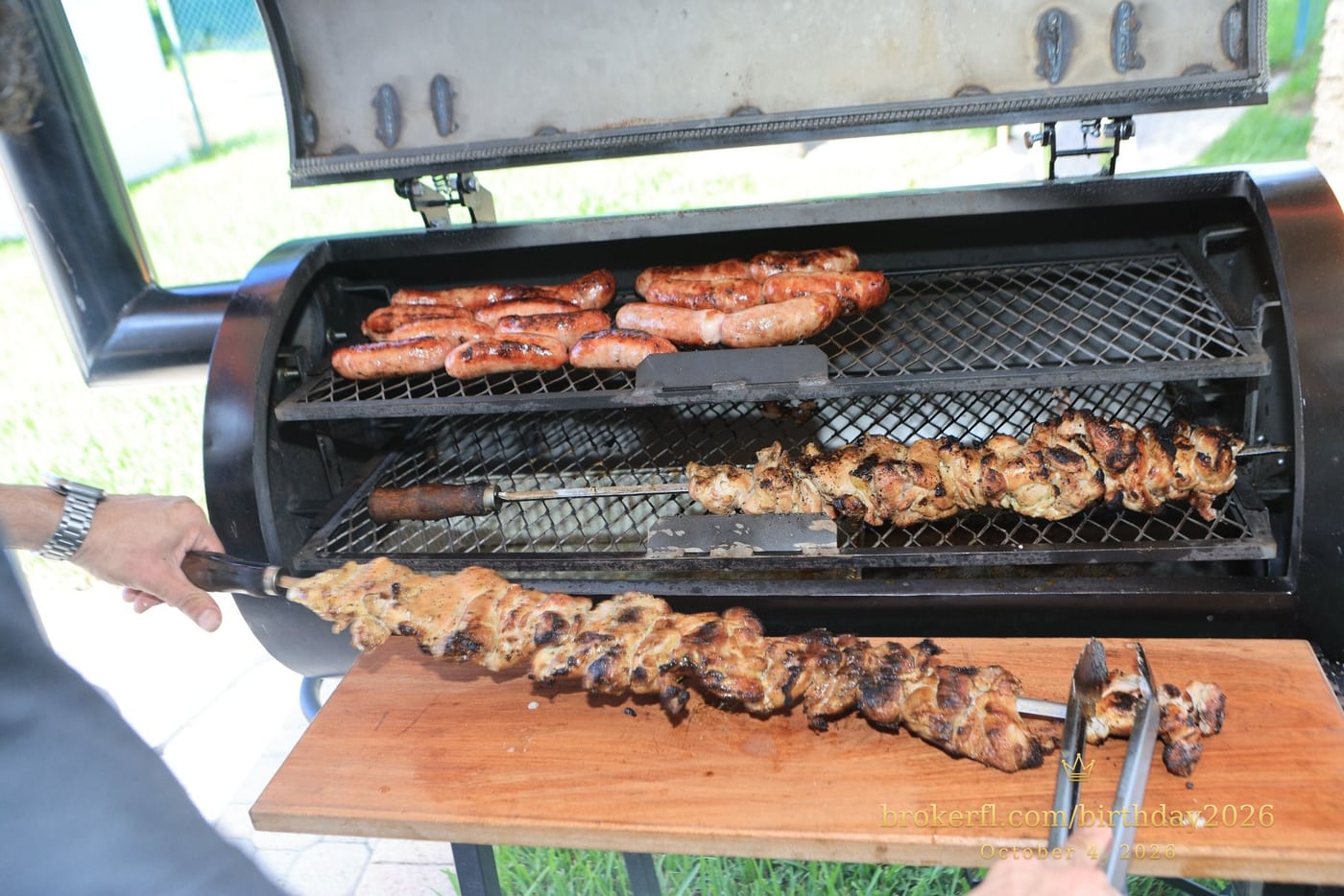 Meat cooking on an open barbecue grill — Karina Leal's birthday, October 4, 2026.