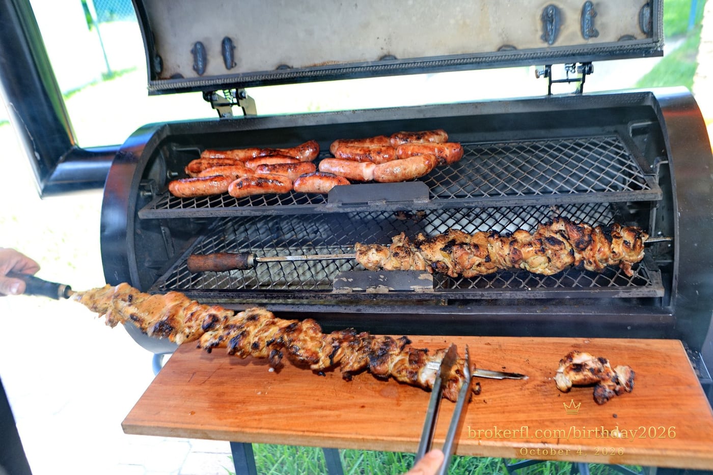 Meat cooking on an open barbecue grill — Karina Leal's birthday, October 4, 2026.