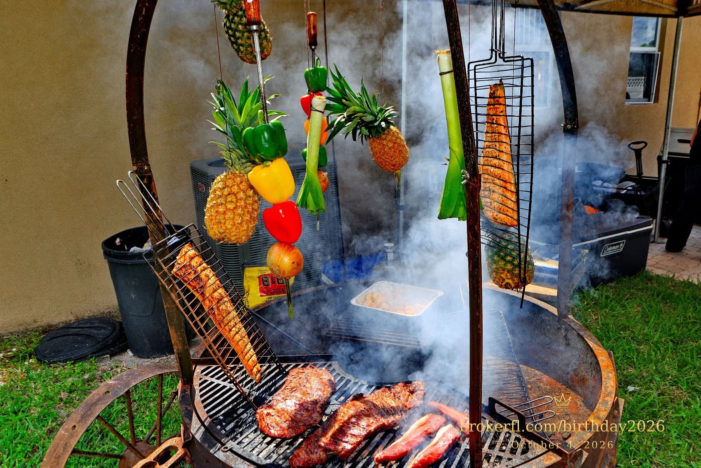Barbecue cooking over an outdoor fire with hanging vegetables — Karina Leal's birthday, October 4, 2026.