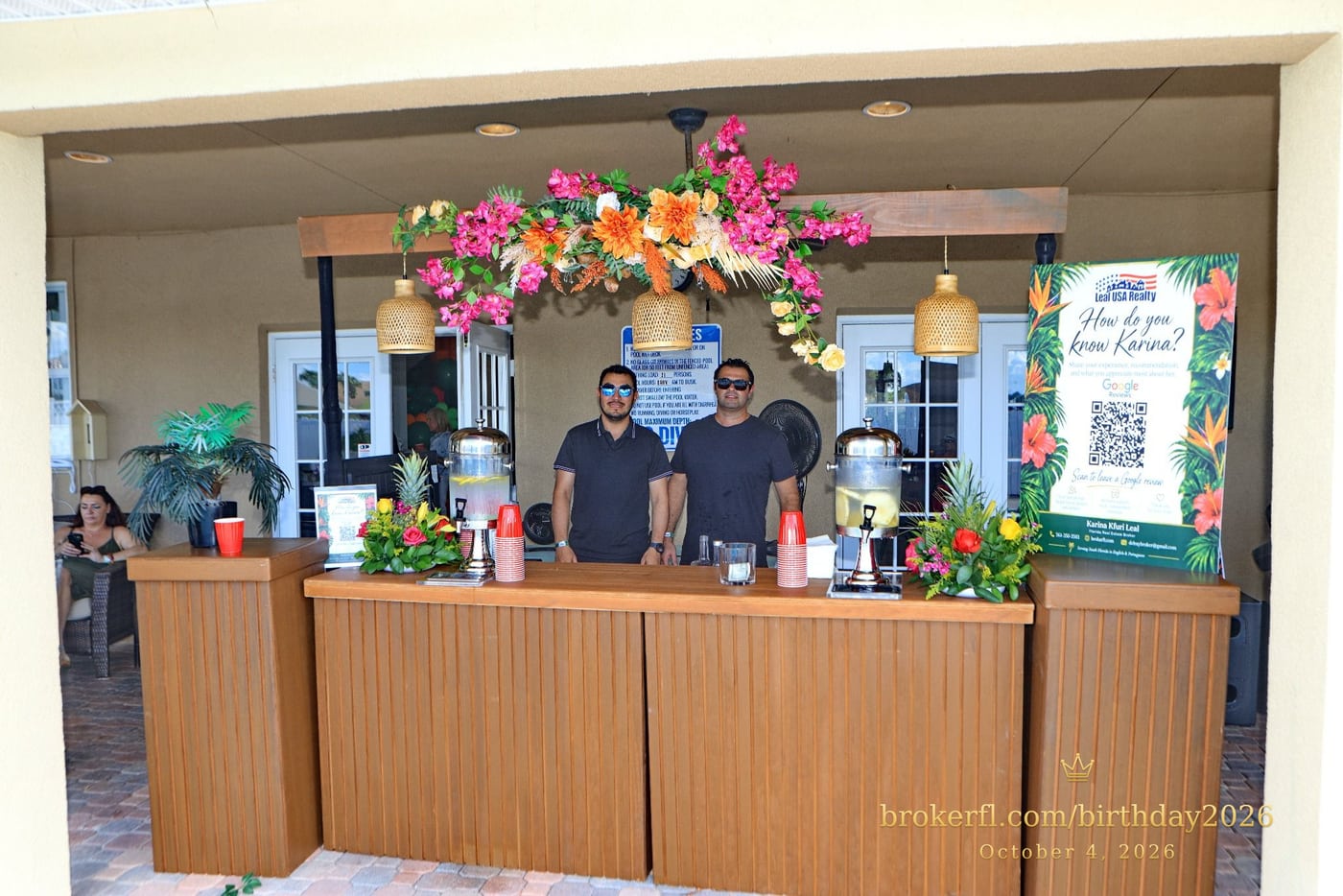 Decorated drinks counter with flowers and beverage dispensers — Karina Leal's birthday, October 4, 2026.