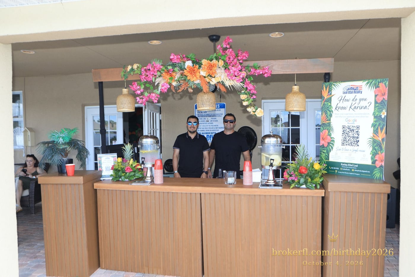 Decorated drinks counter with flowers and beverage dispensers — Karina Leal's birthday, October 4, 2026.
