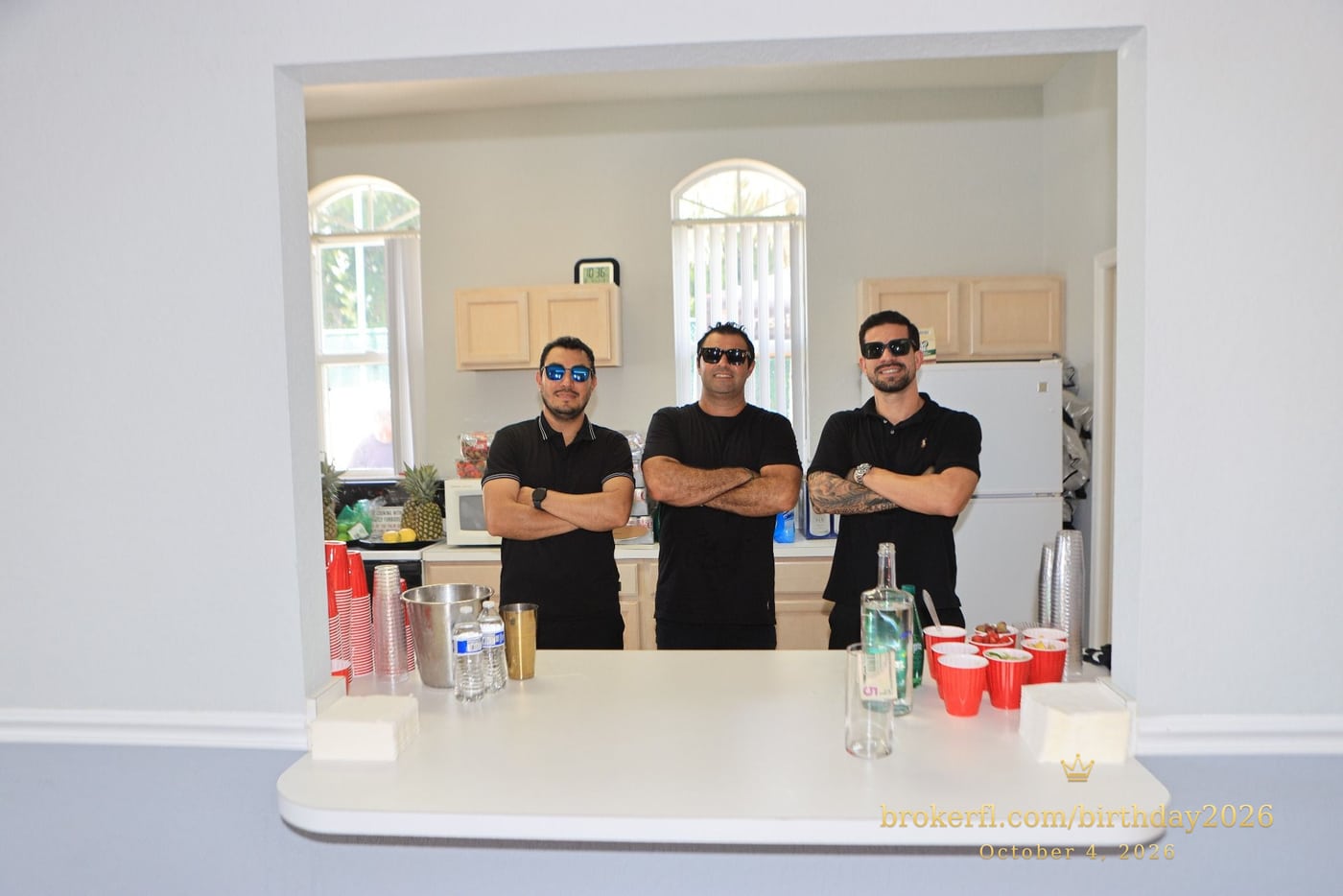 Drinks team posing behind the party counter — Karina Leal's birthday, October 4, 2026.