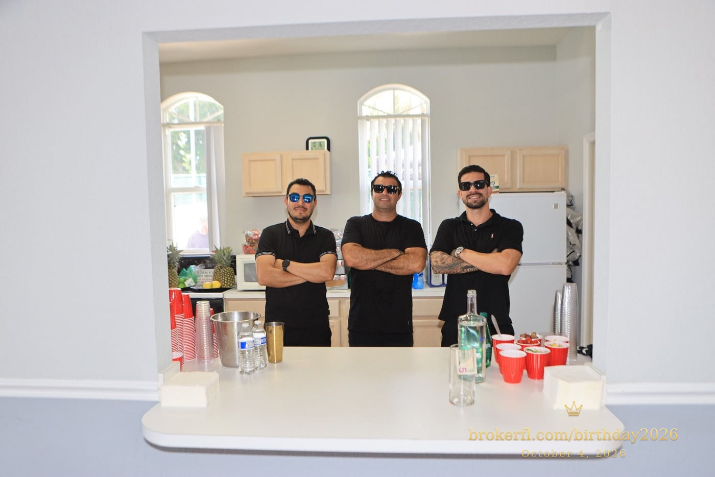 Drinks team posing behind the party counter — Karina Leal's birthday, October 4, 2026.