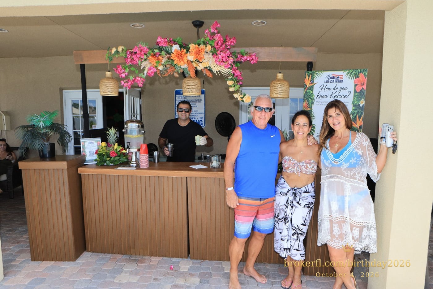 Three guests posing near the drinks counter — Karina Leal's birthday, October 4, 2026.