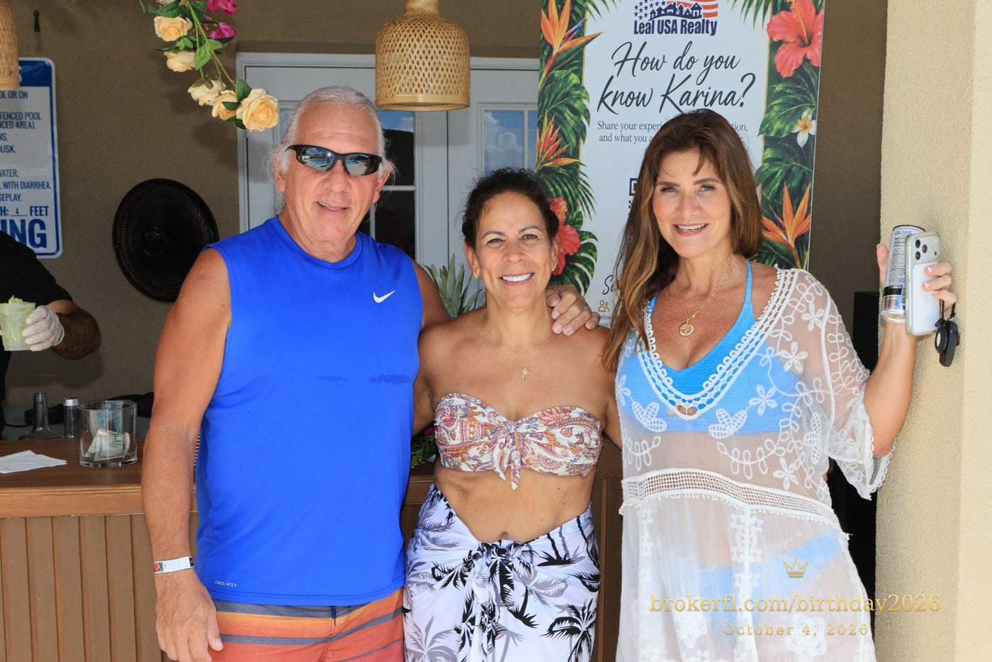 Three guests posing near the drinks counter — Karina Leal's birthday, October 4, 2026.