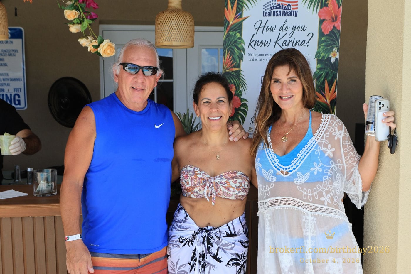 Three guests posing near the drinks counter — Karina Leal's birthday, October 4, 2026.