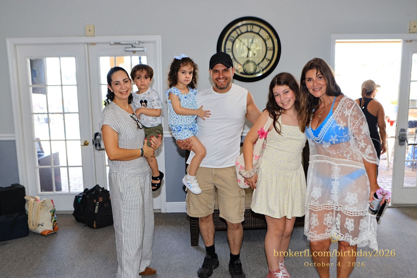 Guests posing together inside the birthday party room — Karina Leal's birthday, October 4, 2026.