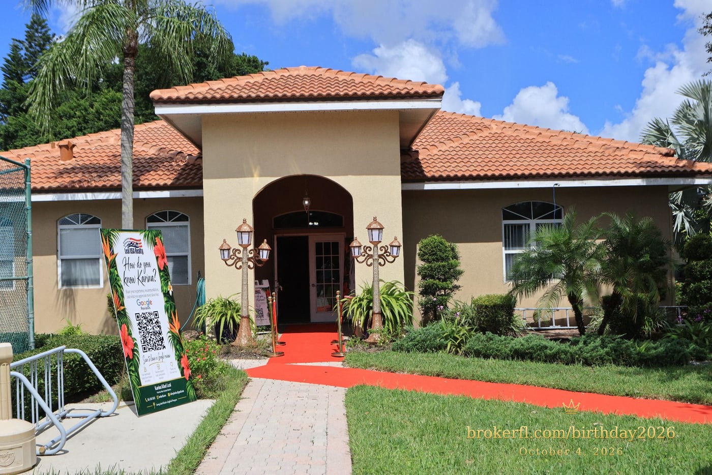 Venue entrance with a red carpet and tropical party signs — Karina Leal's birthday, October 4, 2026.