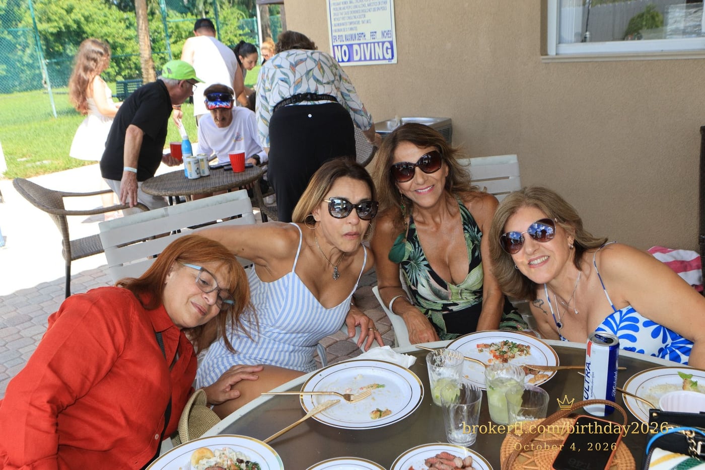 Friends sharing a table on the poolside patio — Karina Leal's birthday, October 4, 2026.