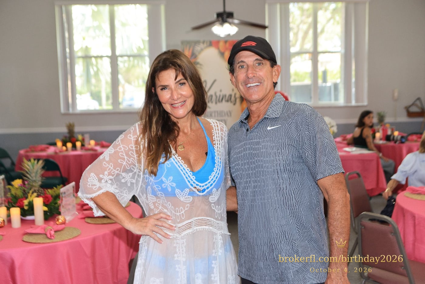 Two guests posing beside the party tables — Karina Leal's birthday, October 4, 2026.