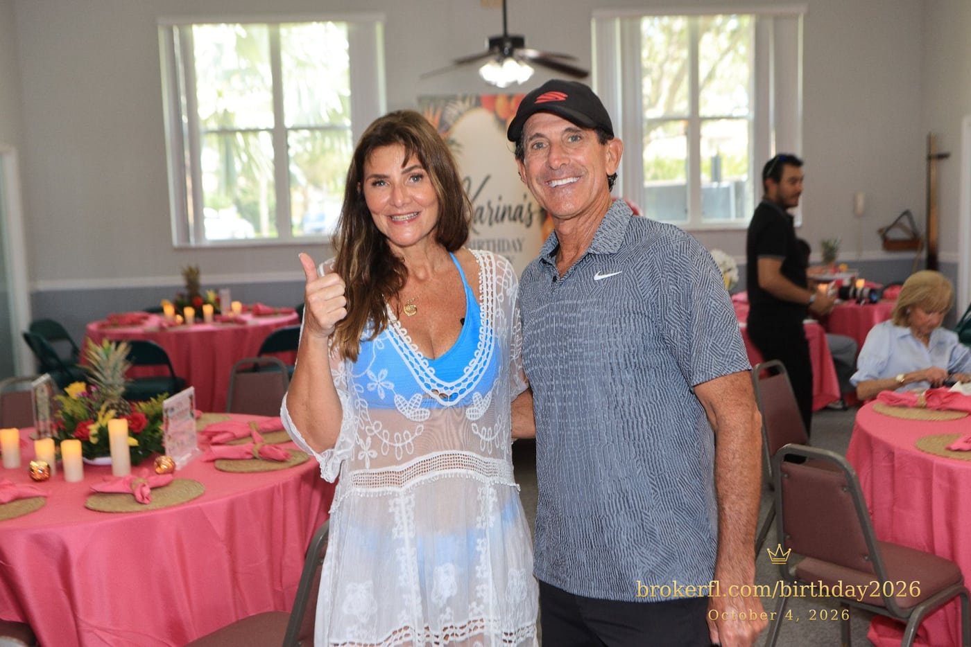 Two guests posing beside the party tables — Karina Leal's birthday, October 4, 2026.