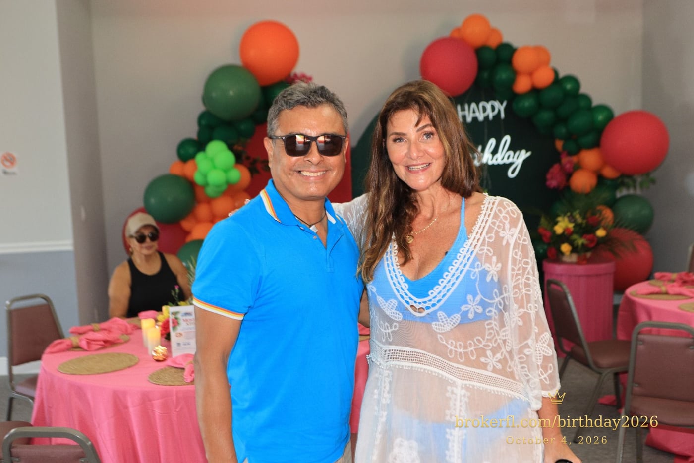 Friends embracing and posing by the birthday backdrop — Karina Leal's birthday, October 4, 2026.