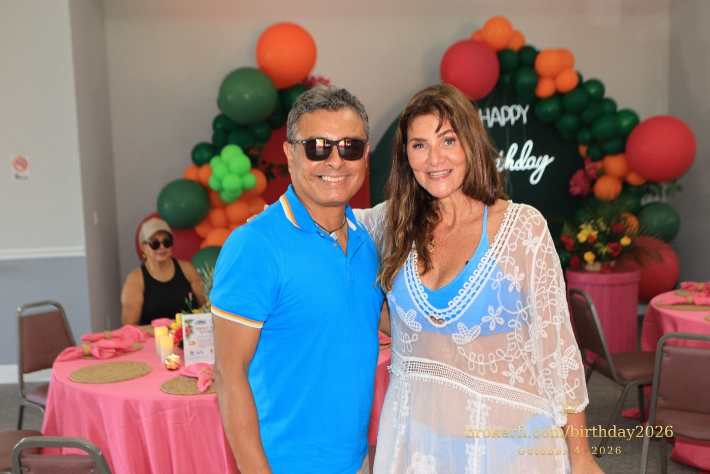 Friends embracing and posing by the birthday backdrop — Karina Leal's birthday, October 4, 2026.