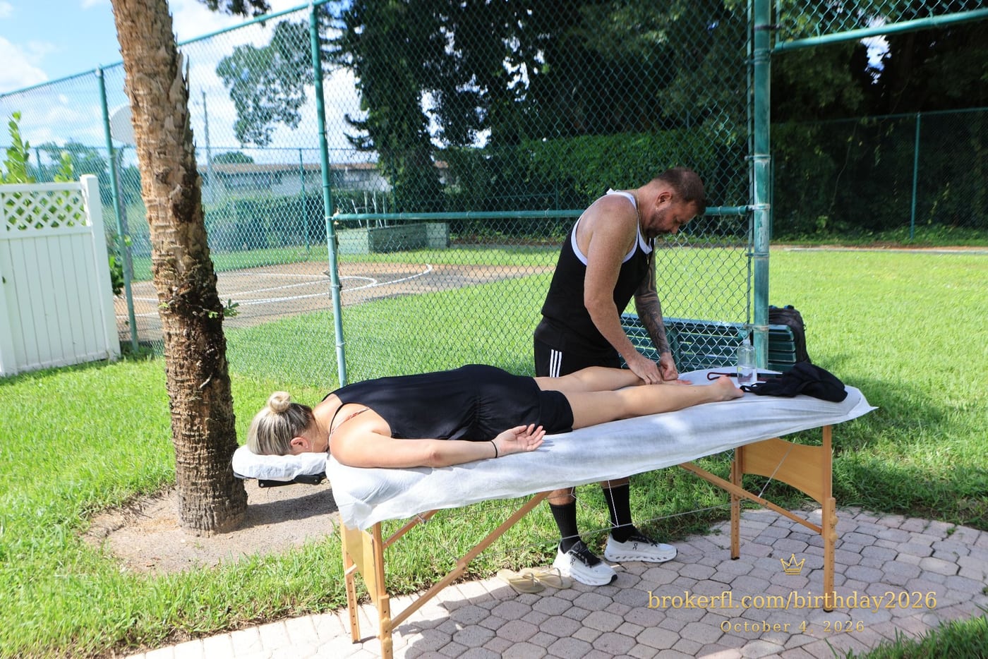 Outdoor massage station beneath a tree during the celebration — Karina Leal's birthday, October 4, 2026.