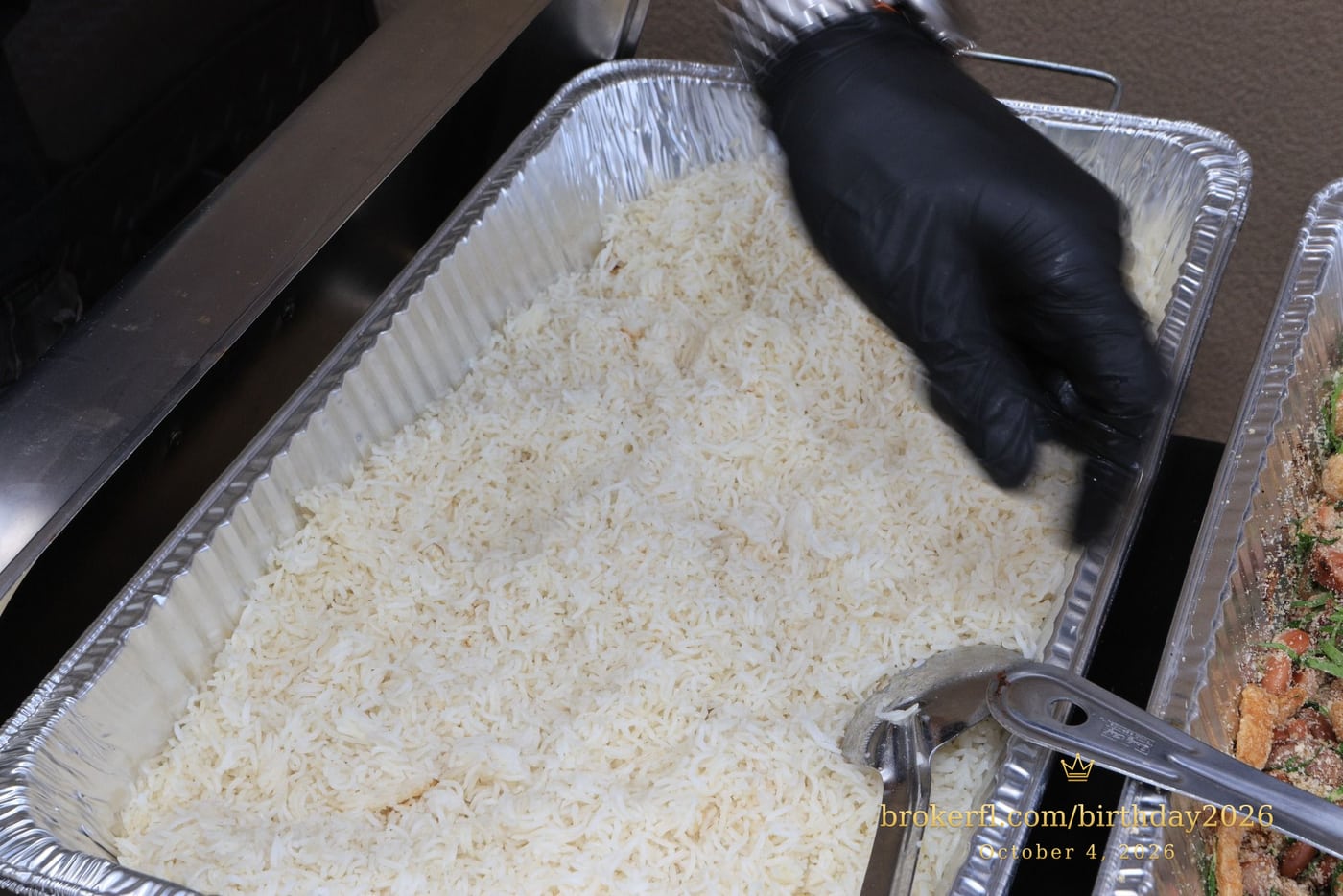 Tray of rice at the party buffet — Karina Leal's birthday, October 4, 2026.