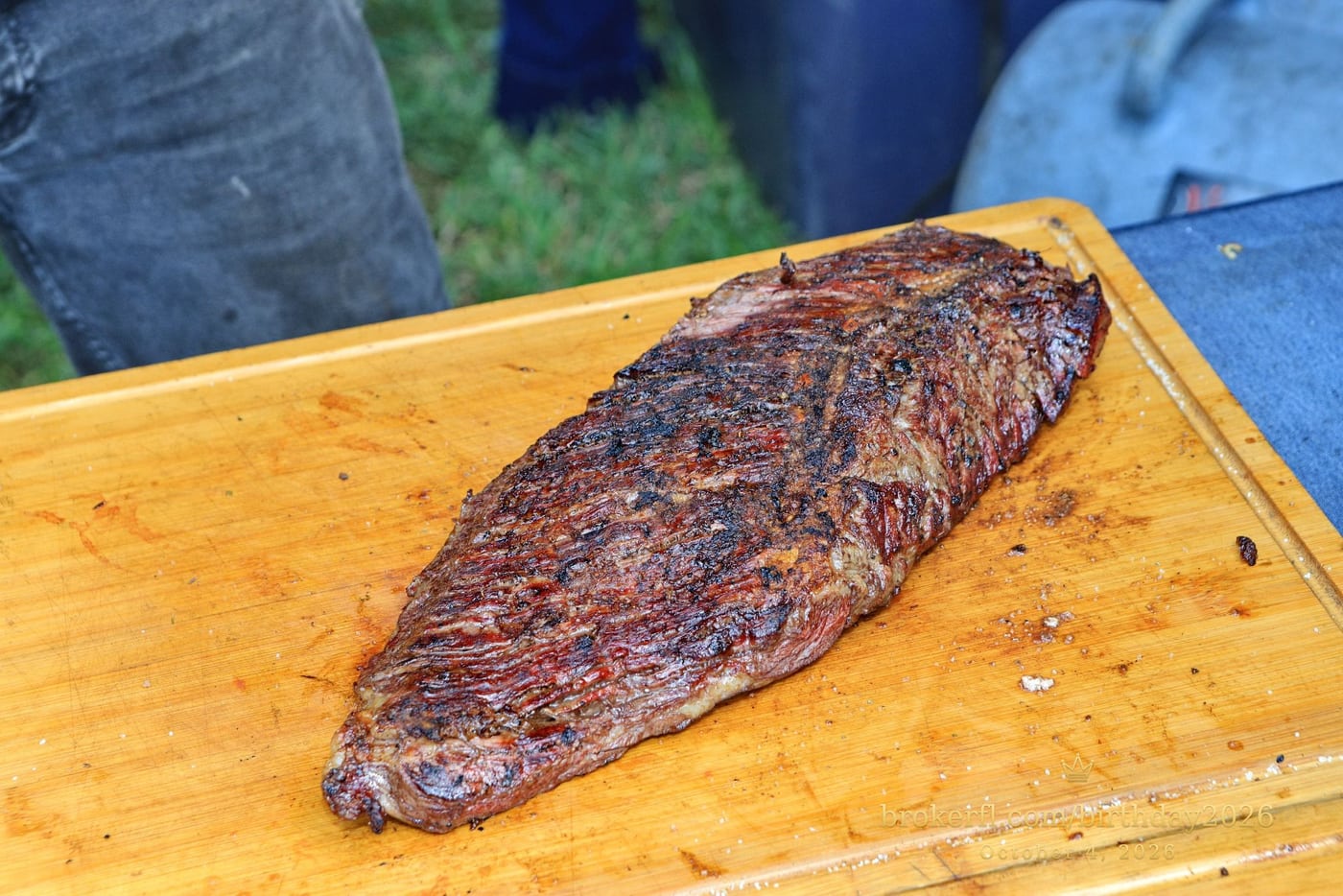 Barbecue meat being sliced on a wooden board — Karina Leal's birthday, October 4, 2026.