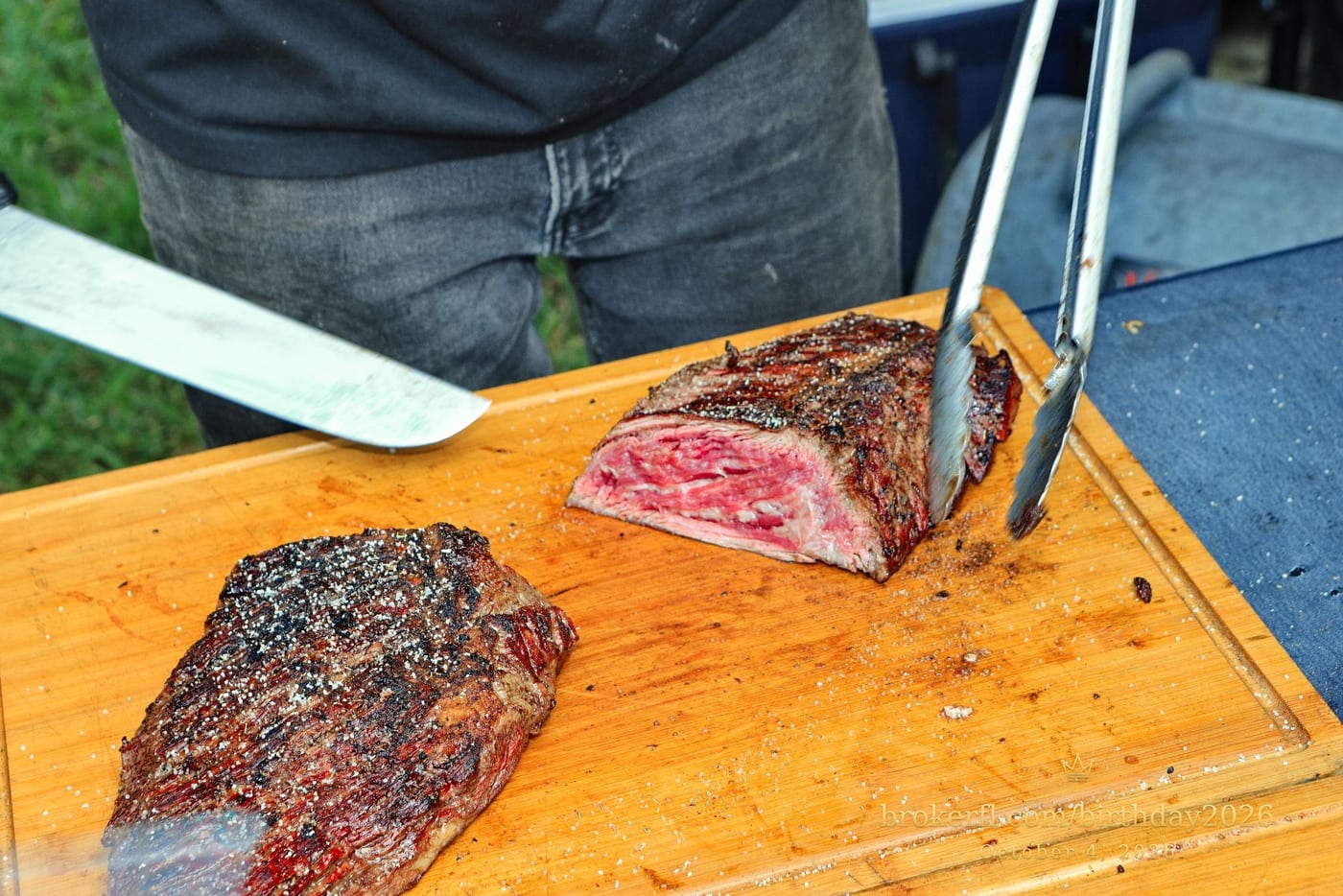 Barbecue meat being sliced on a wooden board — Karina Leal's birthday, October 4, 2026.