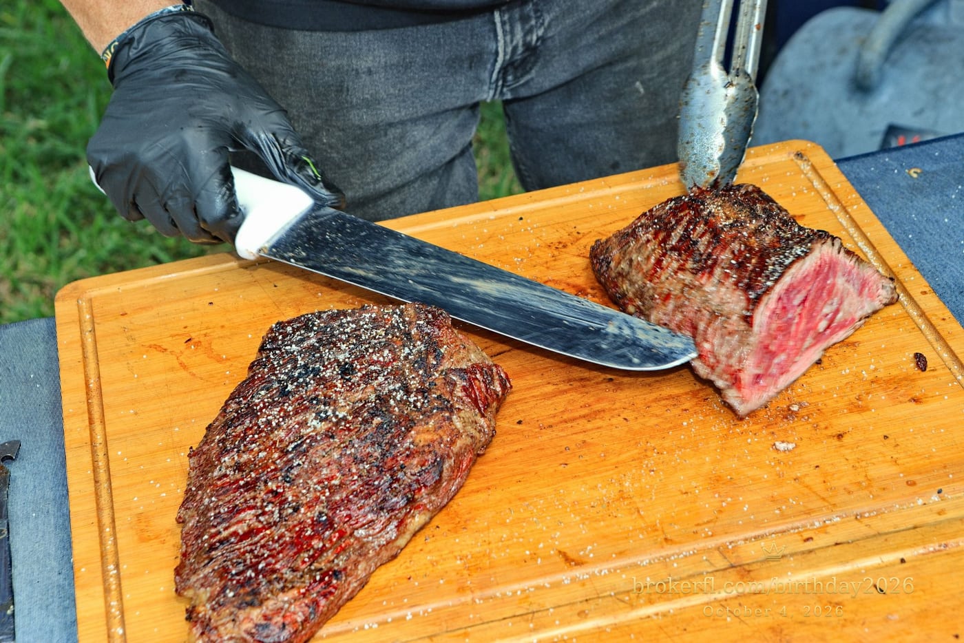 Barbecue meat being sliced on a wooden board — Karina Leal's birthday, October 4, 2026.