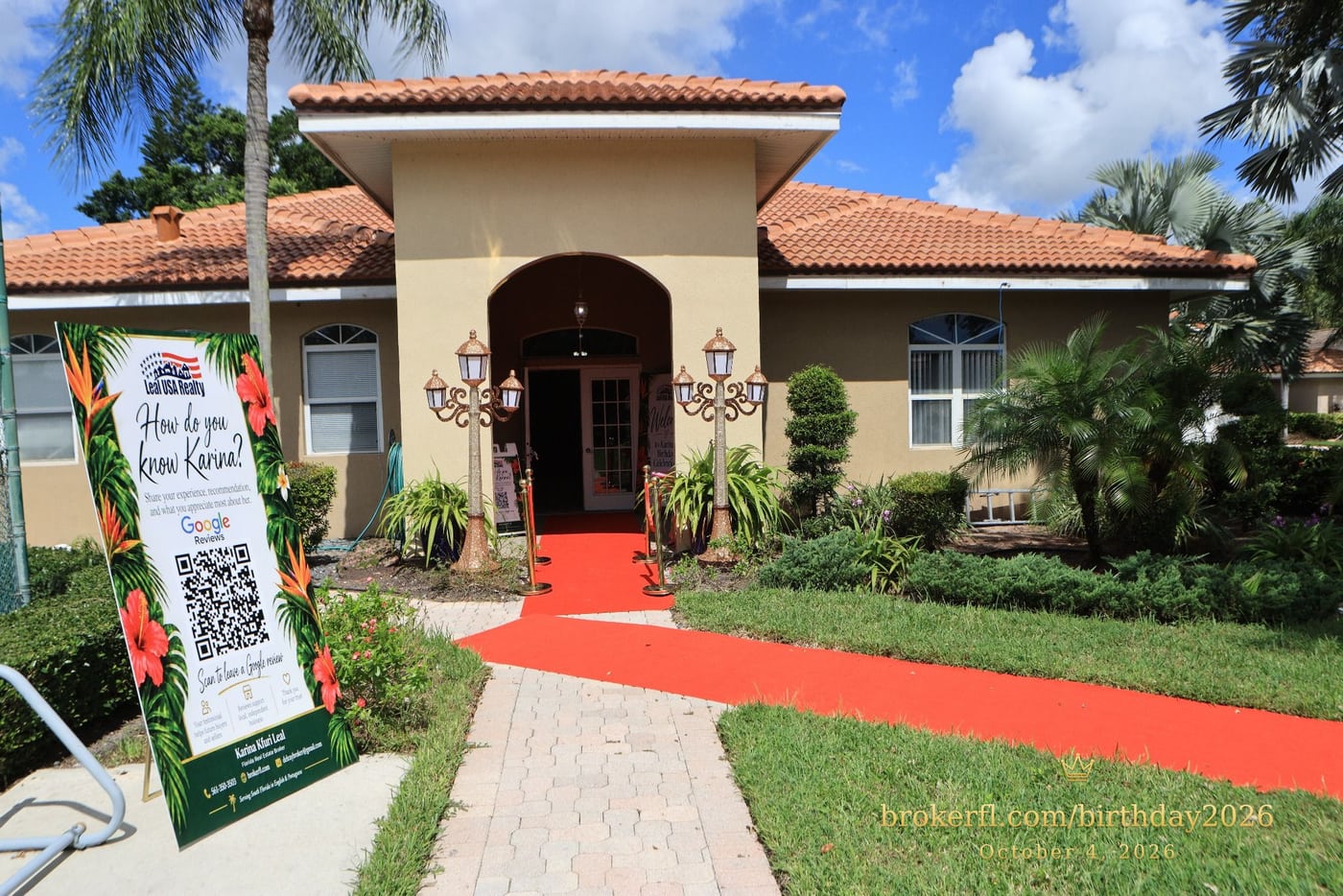 Venue entrance with a red carpet and tropical party signs — Karina Leal's birthday, October 4, 2026.