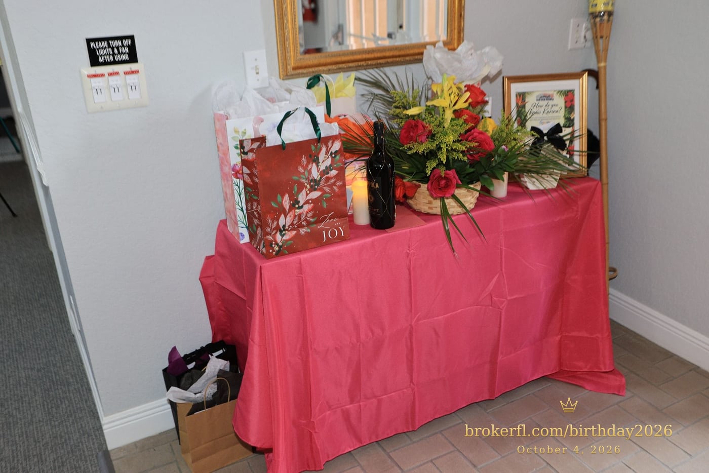 Pink gift table with flowers and wrapped presents — Karina Leal's birthday, October 4, 2026.