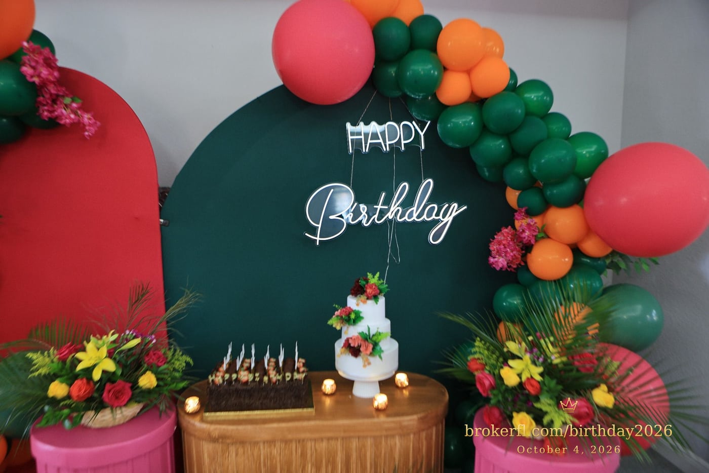 Birthday cake display framed by green and coral balloons — Karina Leal's birthday, October 4, 2026.