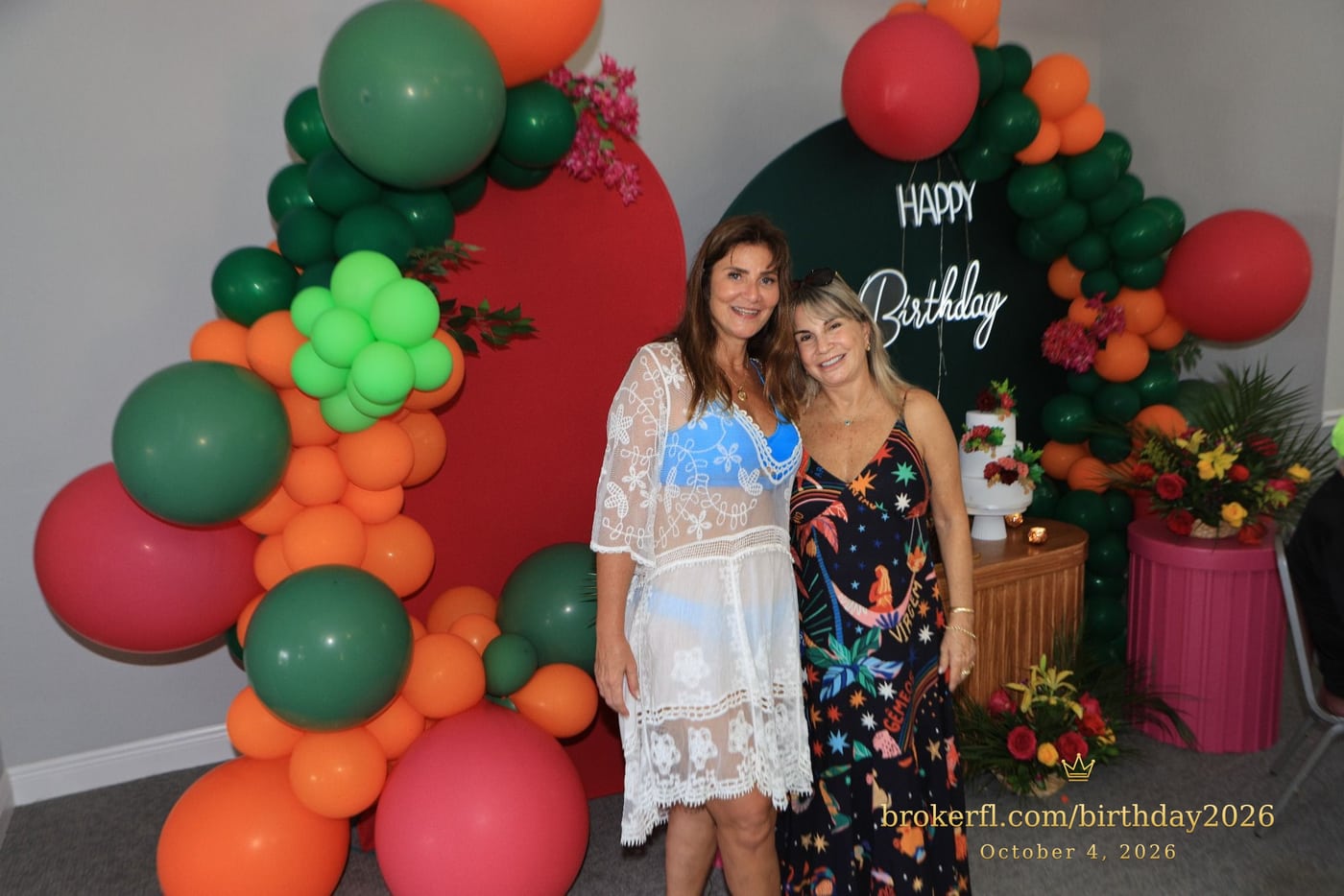 Karina Kfuri Leal with Neildes Esteves, wearing a black floral dress, at Karina’s birthday celebration at Palm Beach Bath & Tennis in Delray Beach.