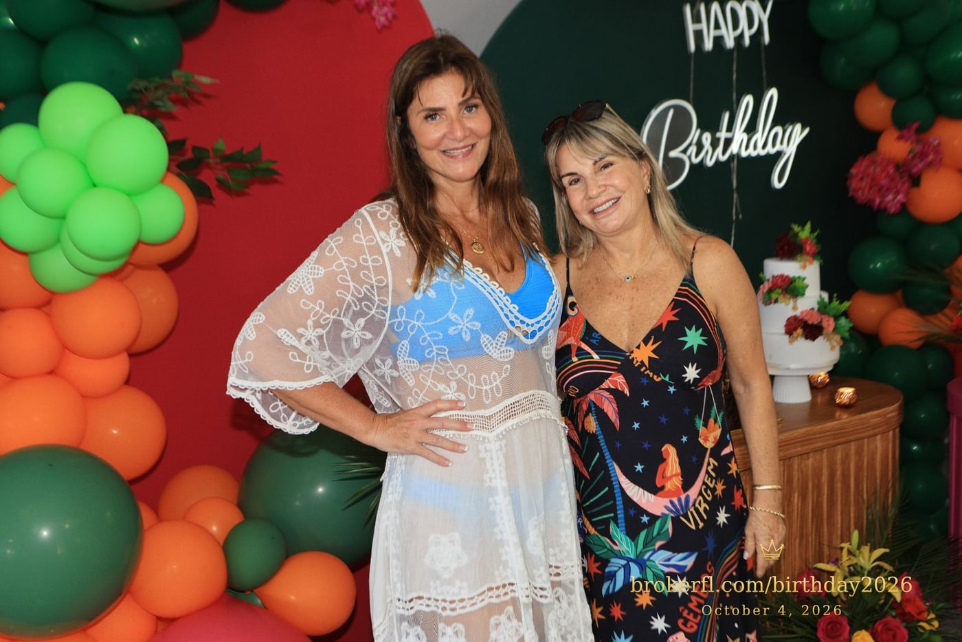 Karina Kfuri Leal with Neildes Esteves, wearing a black floral dress, at Karina’s birthday celebration at Palm Beach Bath & Tennis in Delray Beach.