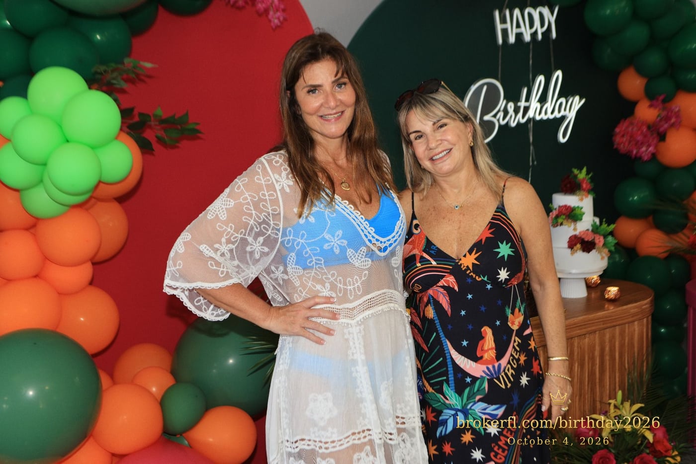 Karina Kfuri Leal with Neildes Esteves, wearing a black floral dress, at Karina’s birthday celebration at Palm Beach Bath & Tennis in Delray Beach.