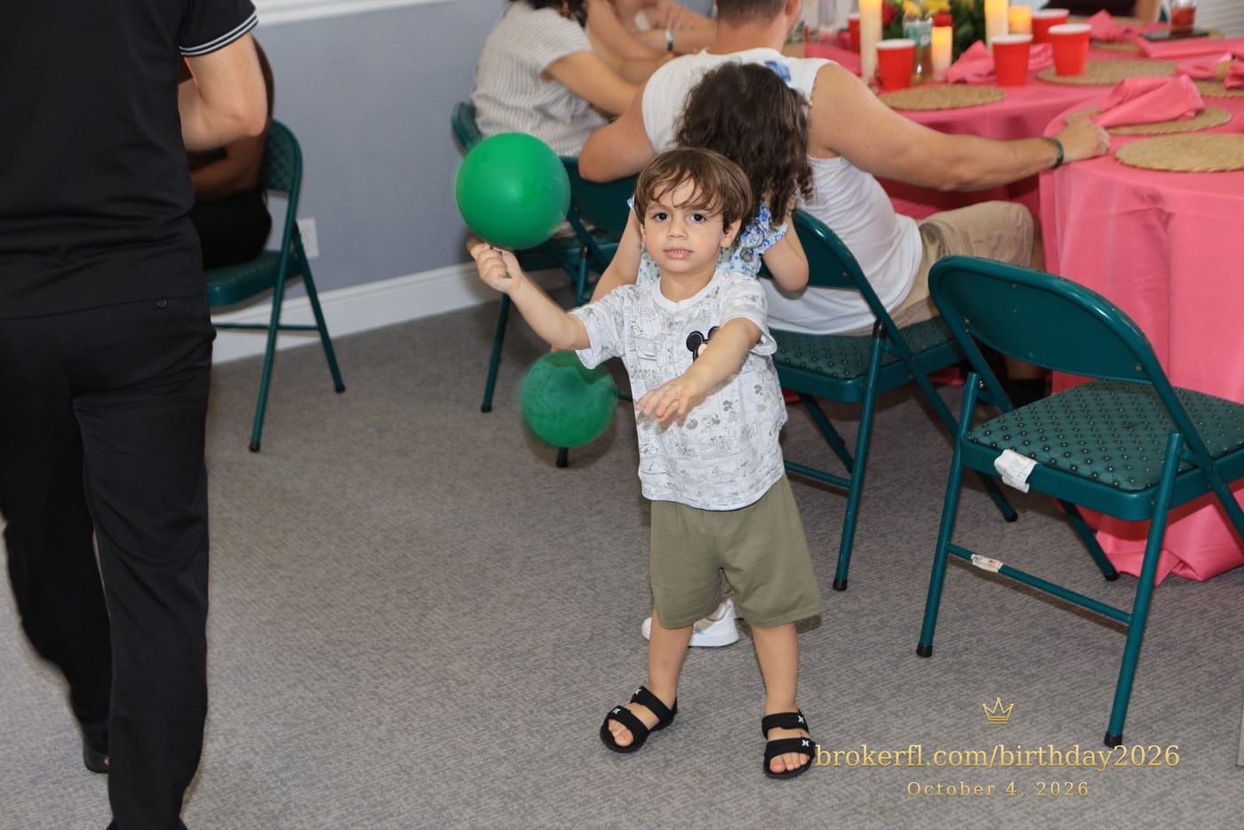 Young guest standing beside the party chairs — Karina Leal's birthday, October 4, 2026.