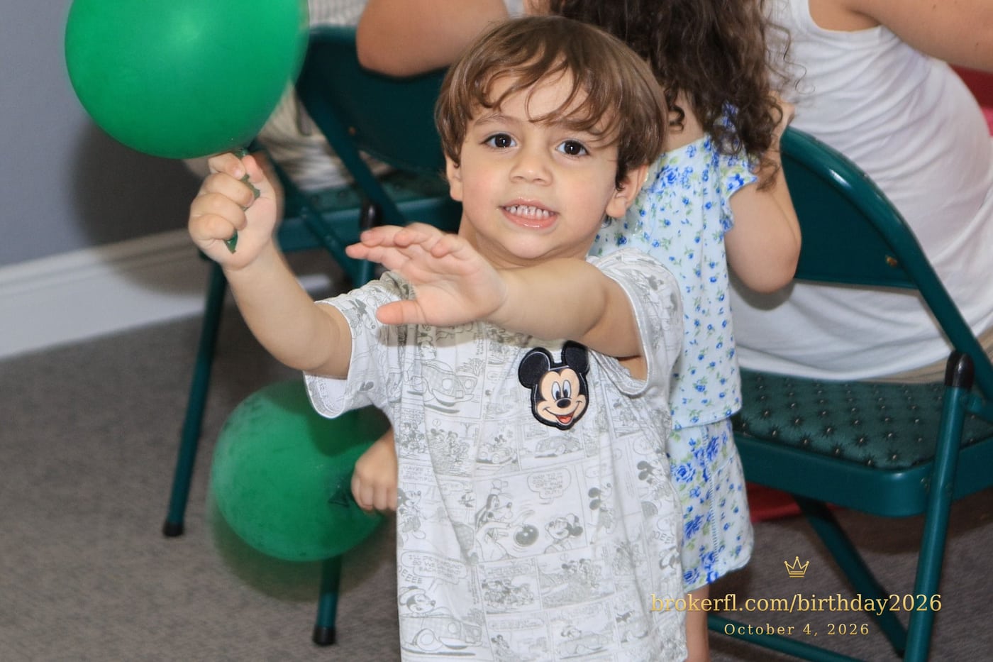 Young guest standing beside the party chairs — Karina Leal's birthday, October 4, 2026.