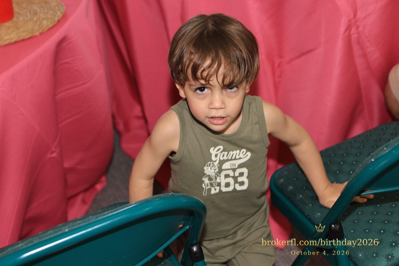 Young guest seated near a pink party table — Karina Leal's birthday, October 4, 2026.