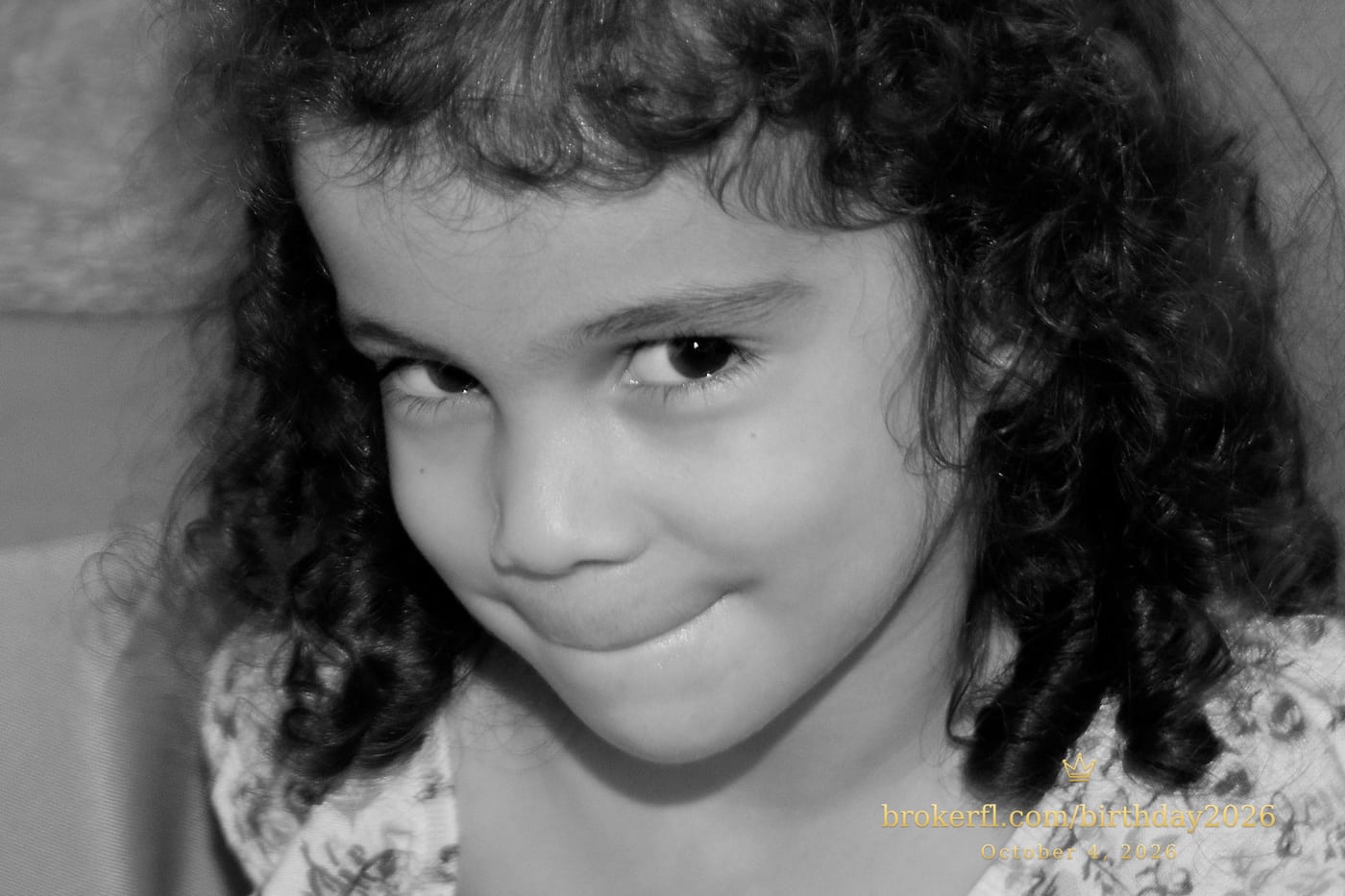 Black-and-white portrait of a young guest at the birthday celebration — Karina Leal's birthday, October 4, 2026.