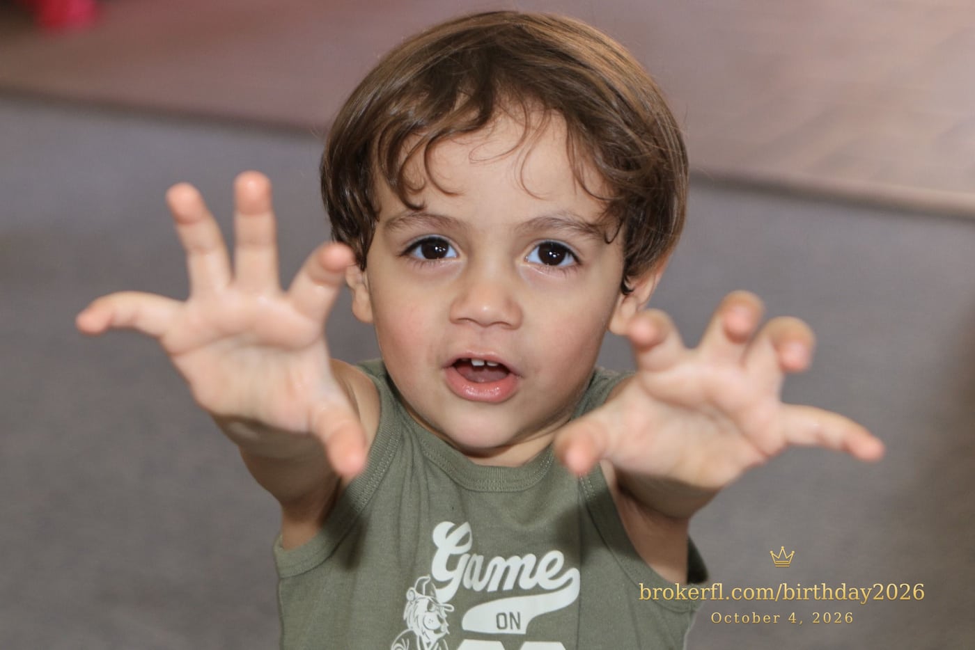Young guest reaching toward the camera inside the party room — Karina Leal's birthday, October 4, 2026.