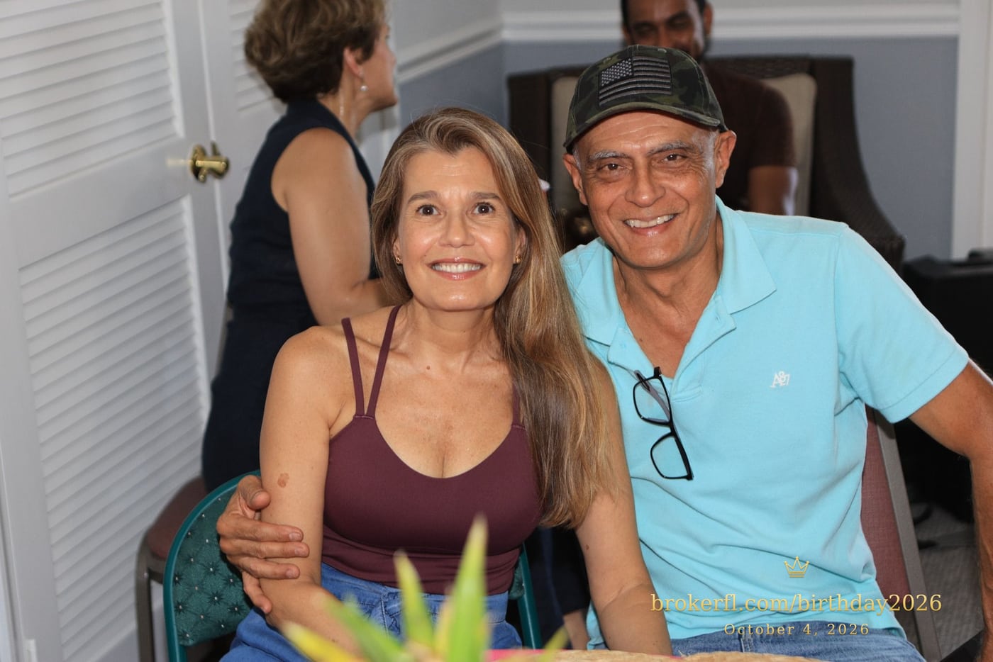 Two guests smiling together near the party tables — Karina Leal's birthday, October 4, 2026.