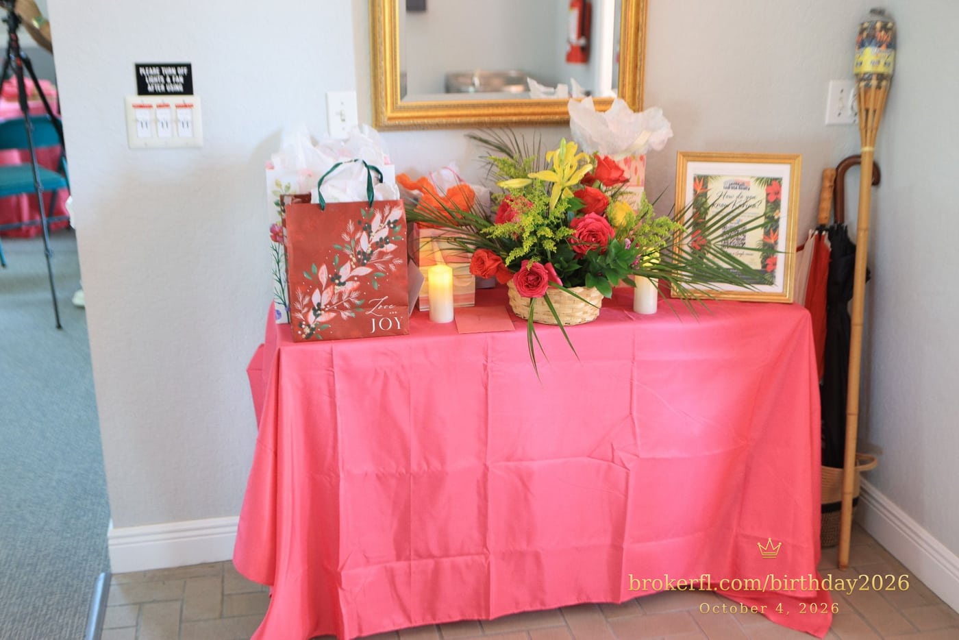 Pink gift table with flowers and wrapped presents — Karina Leal's birthday, October 4, 2026.