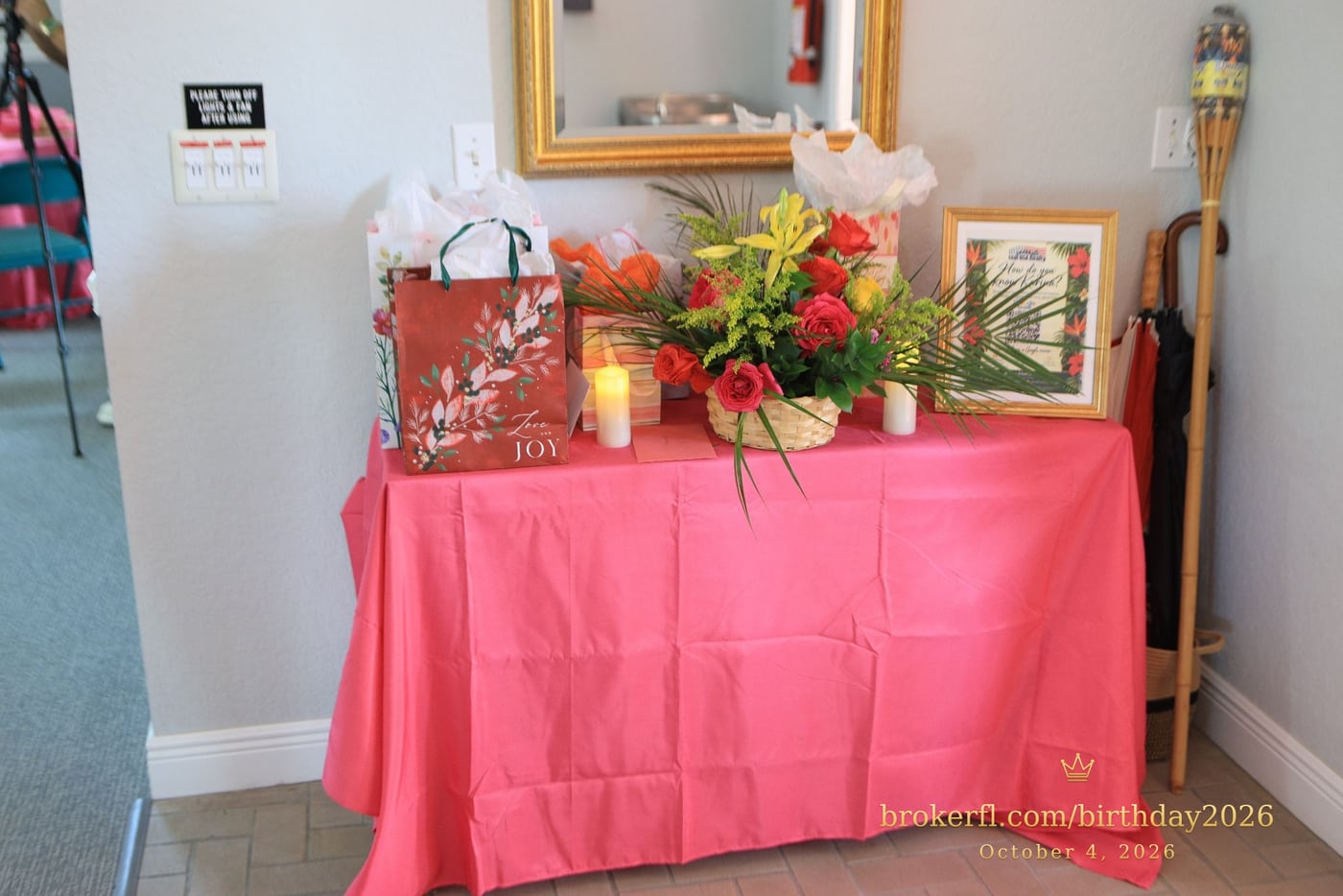 Pink gift table with flowers and wrapped presents — Karina Leal's birthday, October 4, 2026.