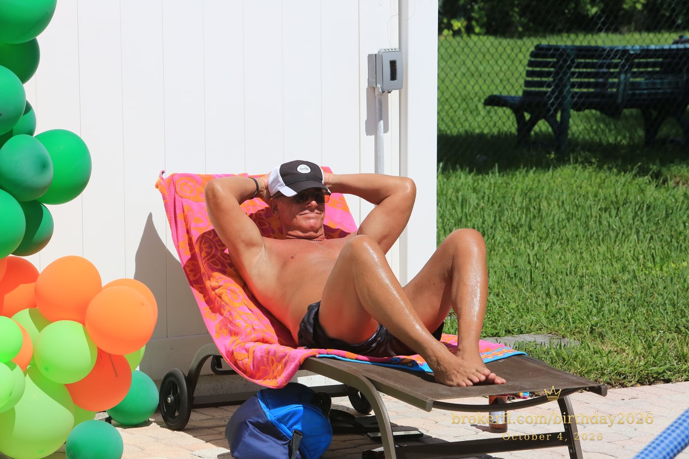 Guest relaxing in a red swimsuit on a poolside lounge chair — Karina Leal's birthday, October 4, 2026.