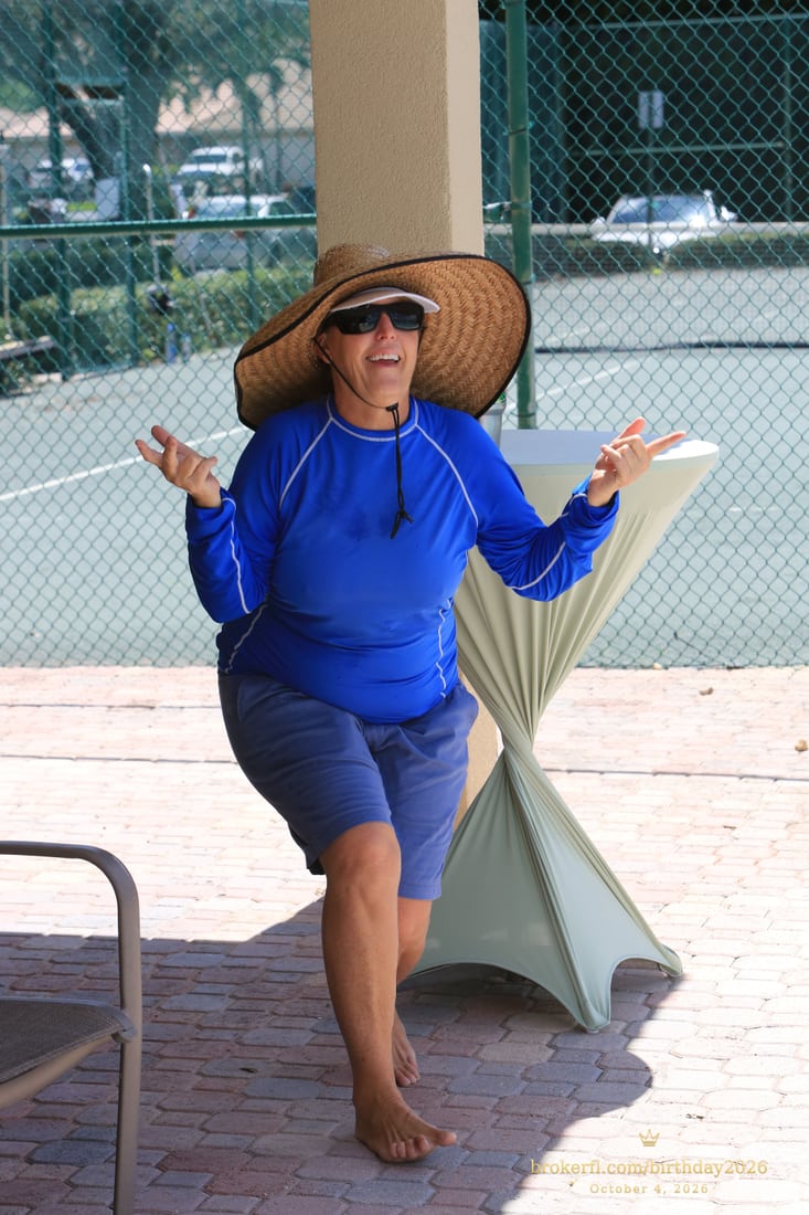 Joe “Wags” Wagenhals, the lifeguard, in blue with a wide-brimmed hat at Karina’s birthday celebration.
