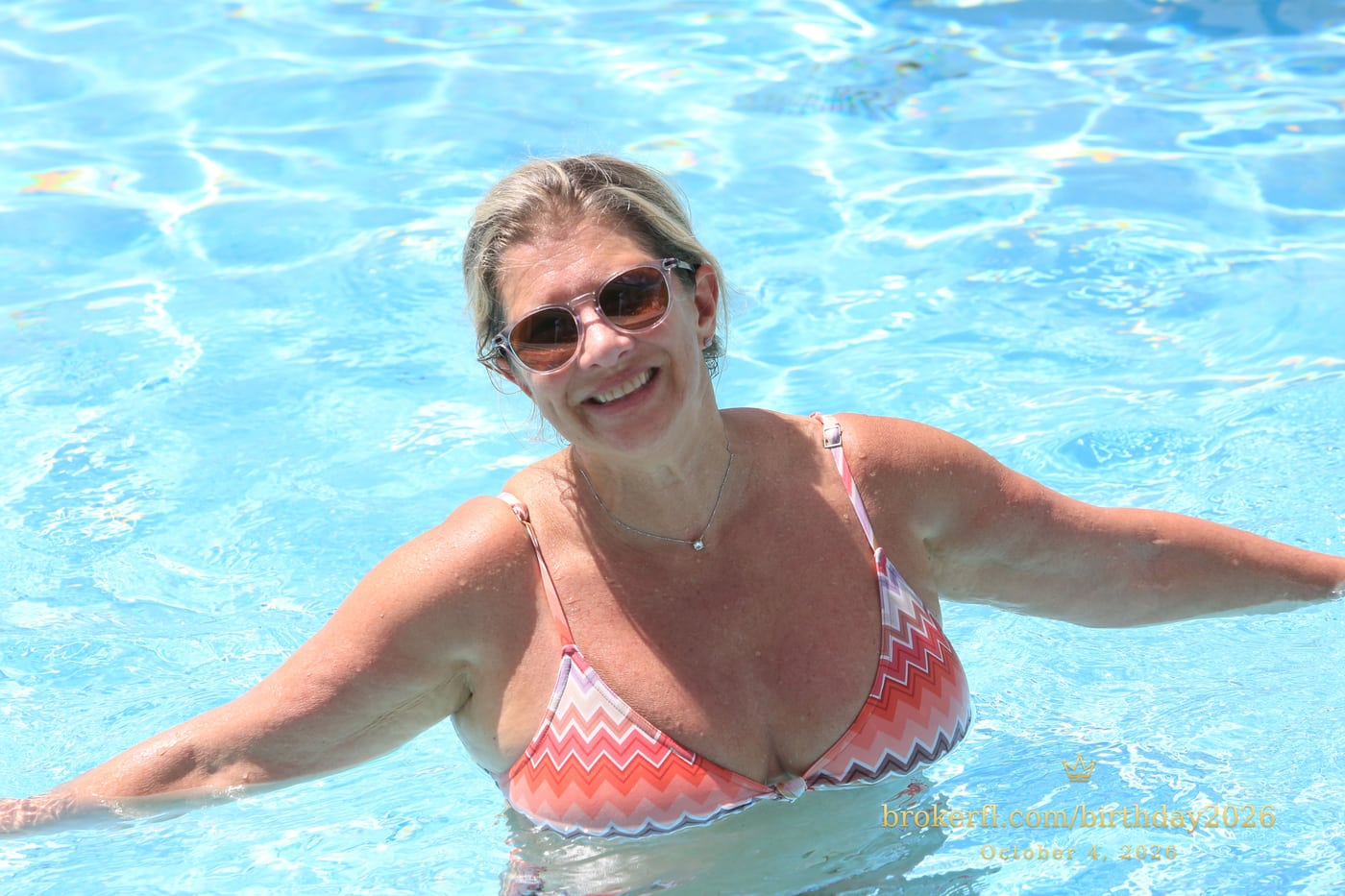 Guest smiling and relaxing in the swimming pool — Karina Leal's birthday, October 4, 2026.