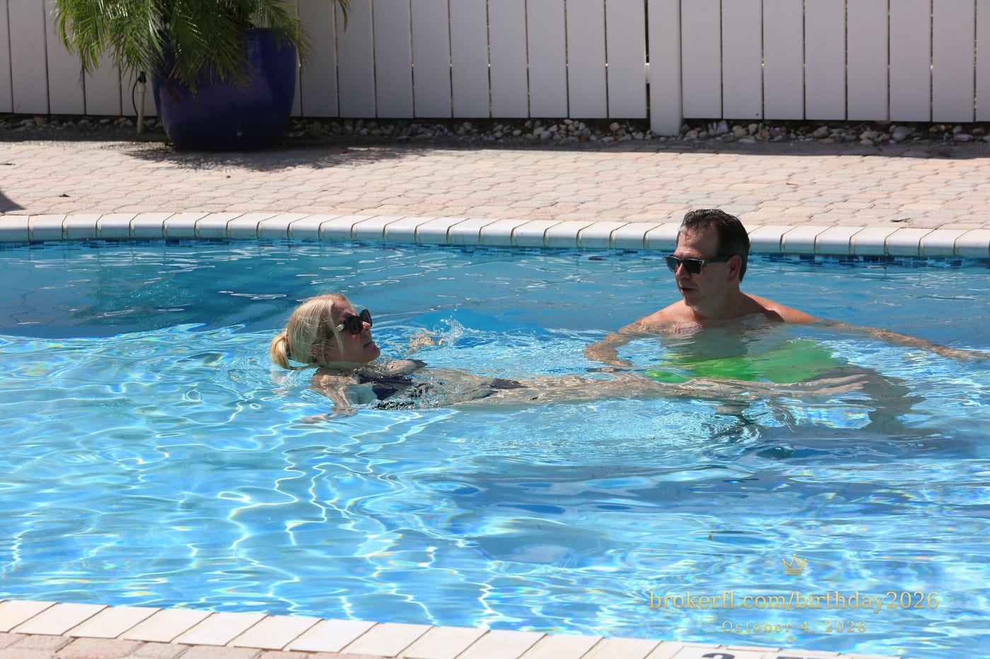 Guests chatting in the swimming pool — Karina Leal's birthday, October 4, 2026.